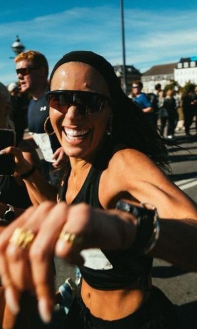 A smiling athlete in sunglasses